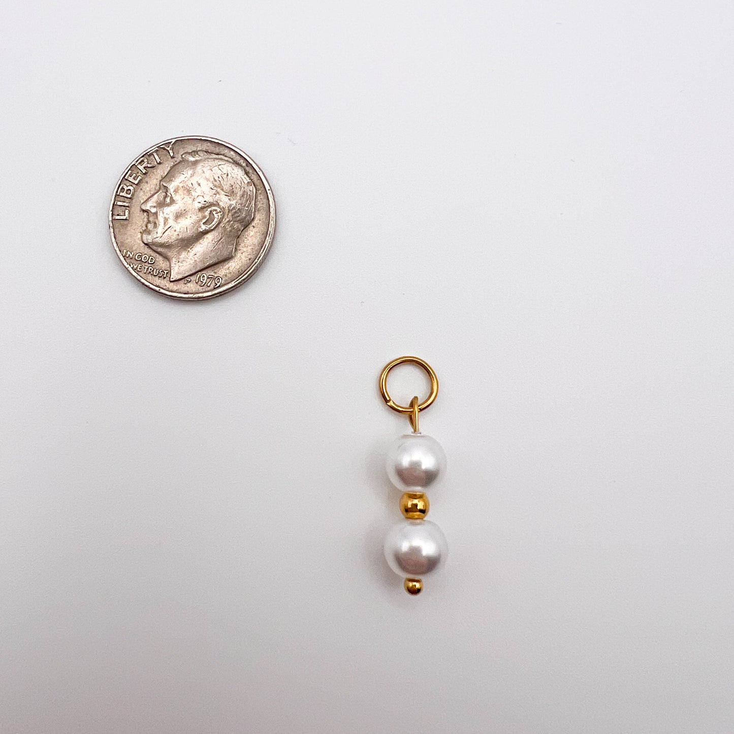 Pearl charm with gold accent