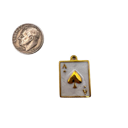 Gold playing card pendant with ace of spades design 