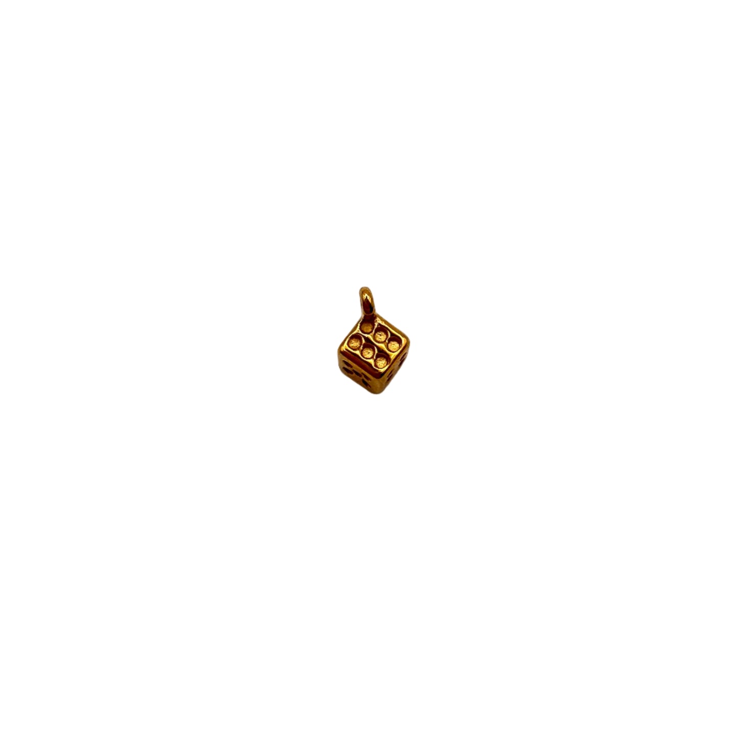 Gold dice charm on a white background