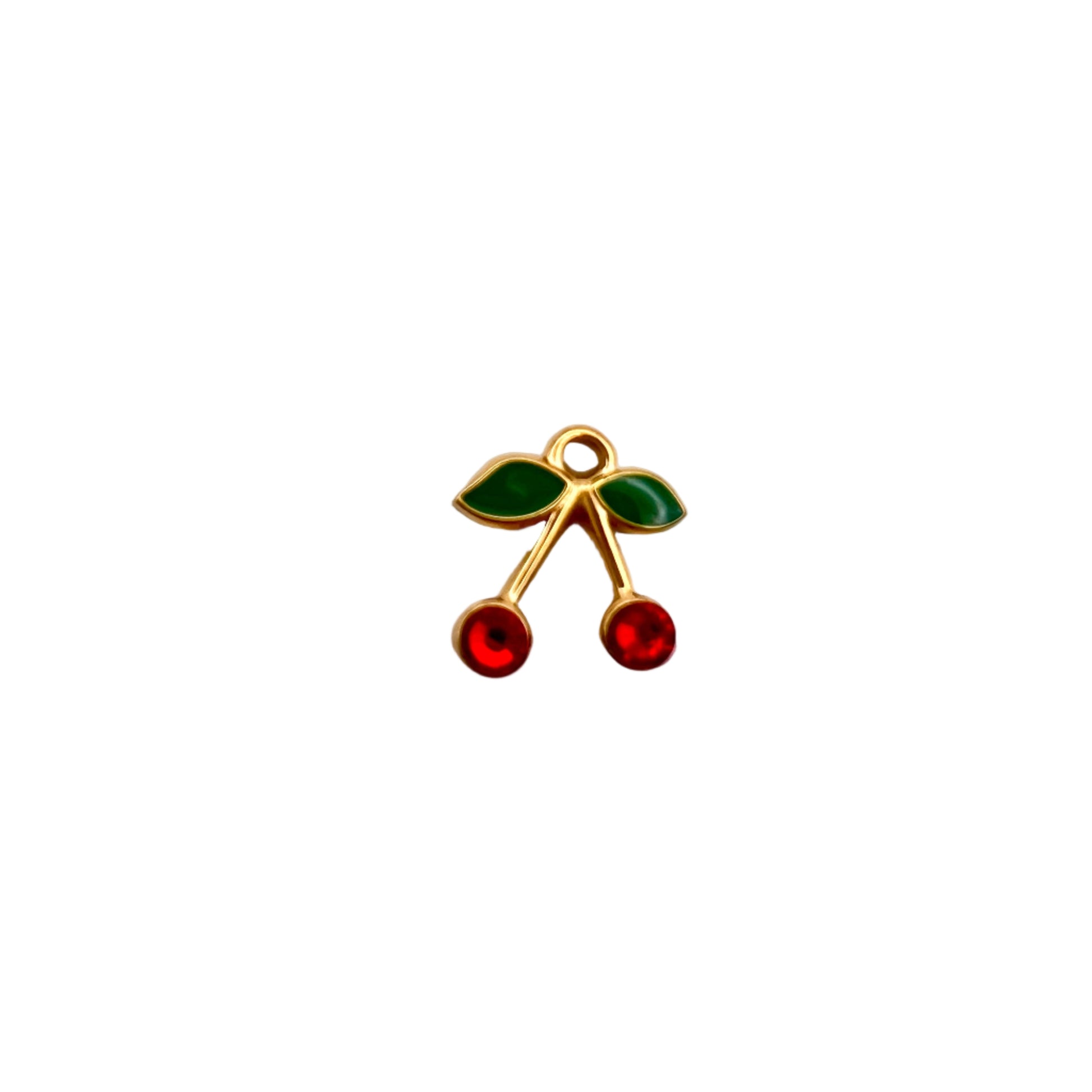 Cherry-themed pendant with red and green stones on a light gray background