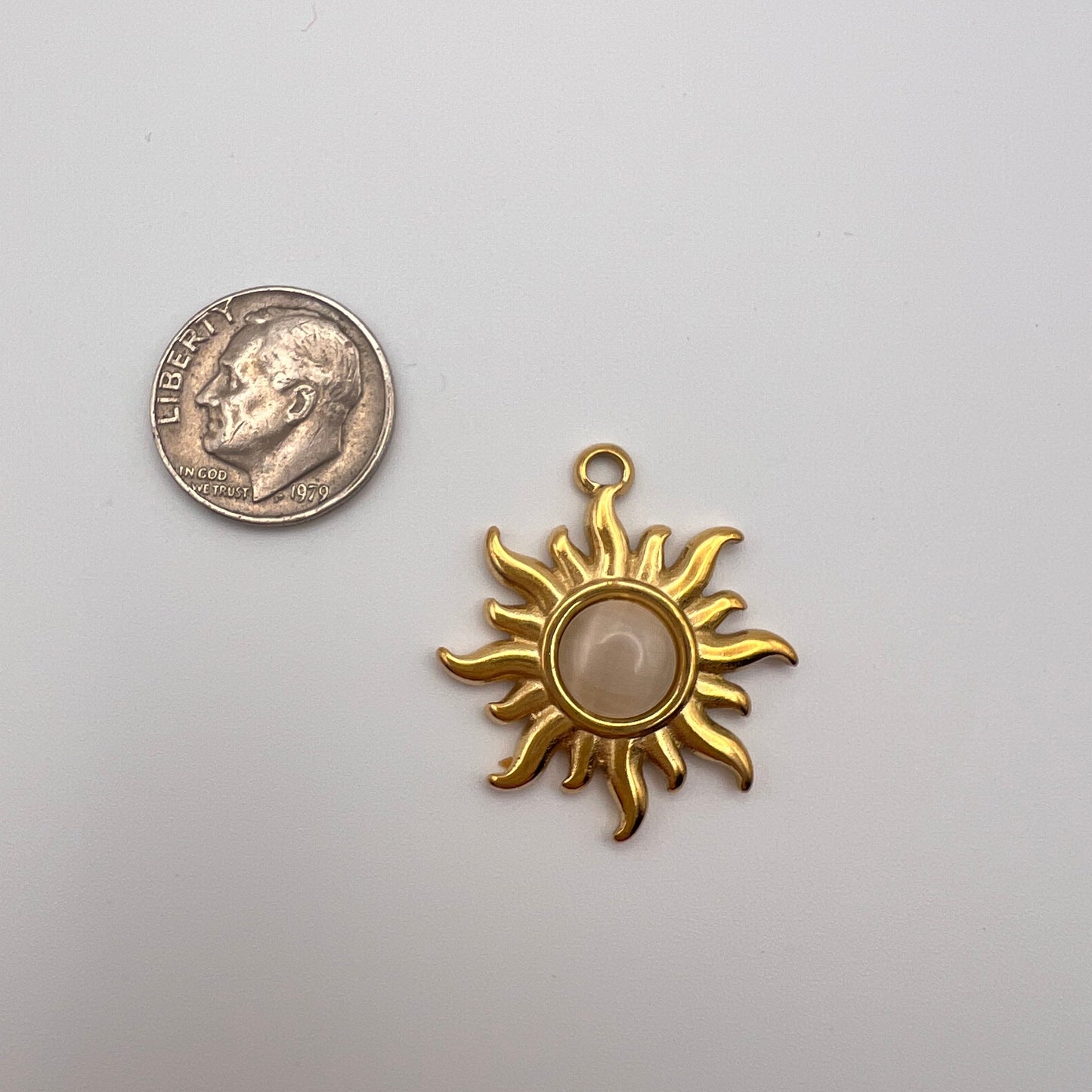 Gold sun-shaped pendant 
