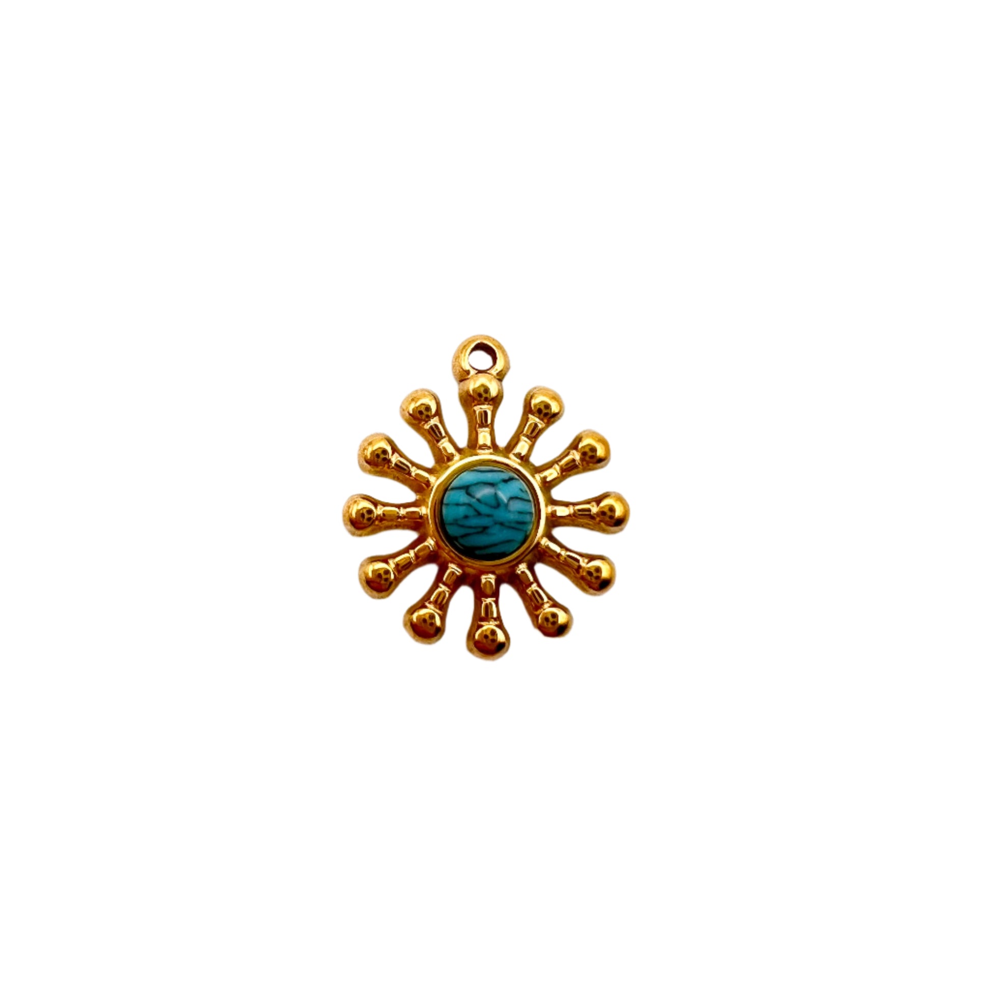 Gold sun-shaped pendant with a turquoise center on a white background