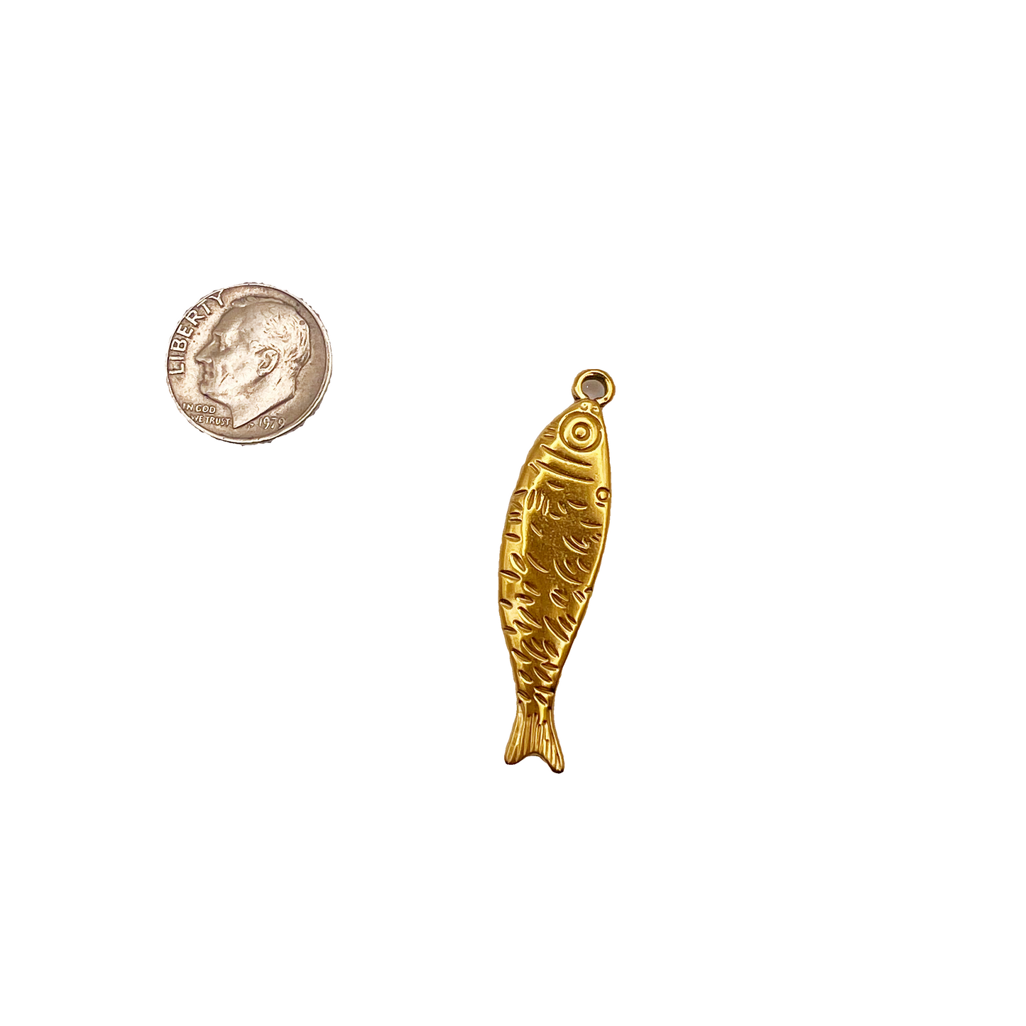 Gold fish-shaped pendant next to a U.S. quarter for size comparison on a white background