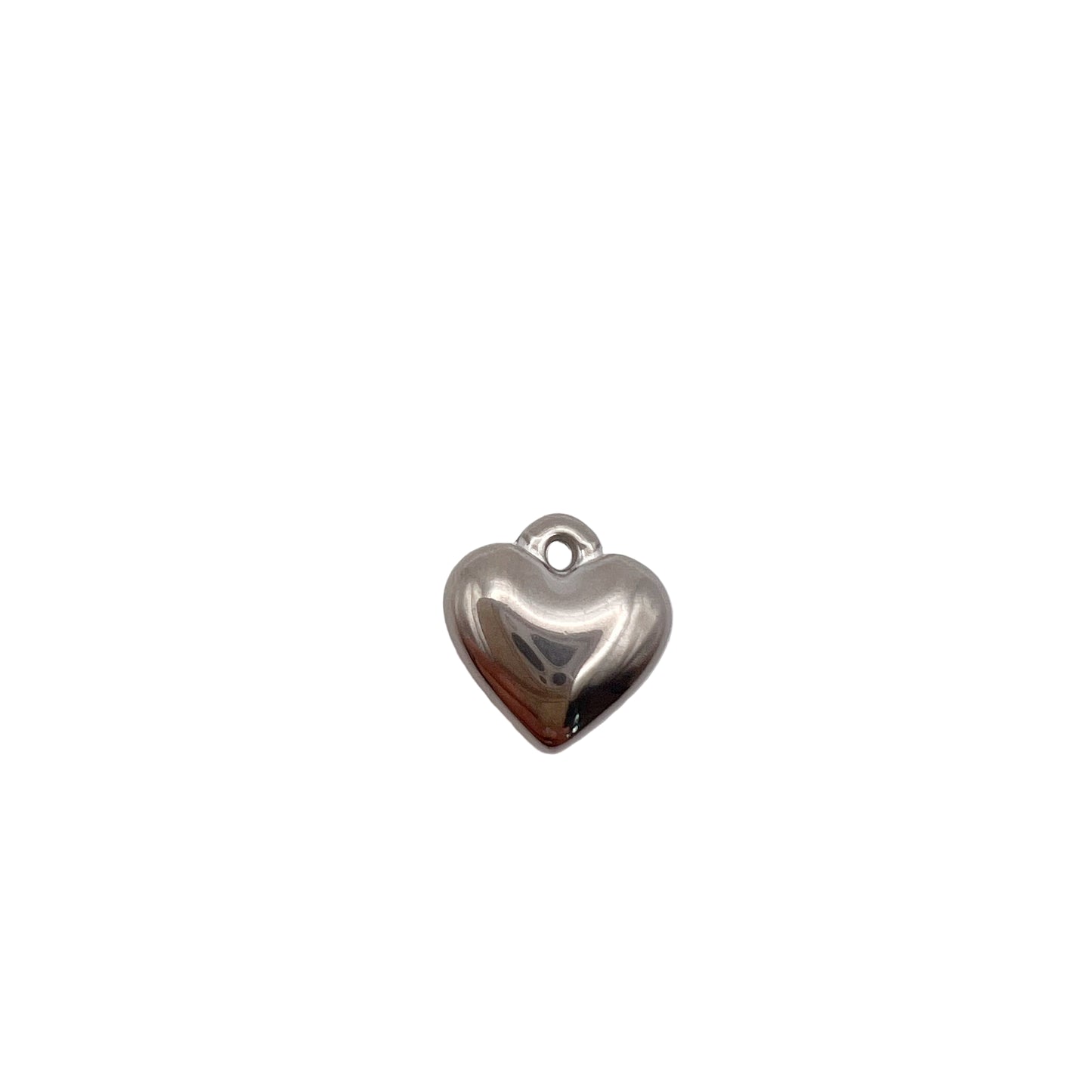 Silver heart-shaped charm on a white background