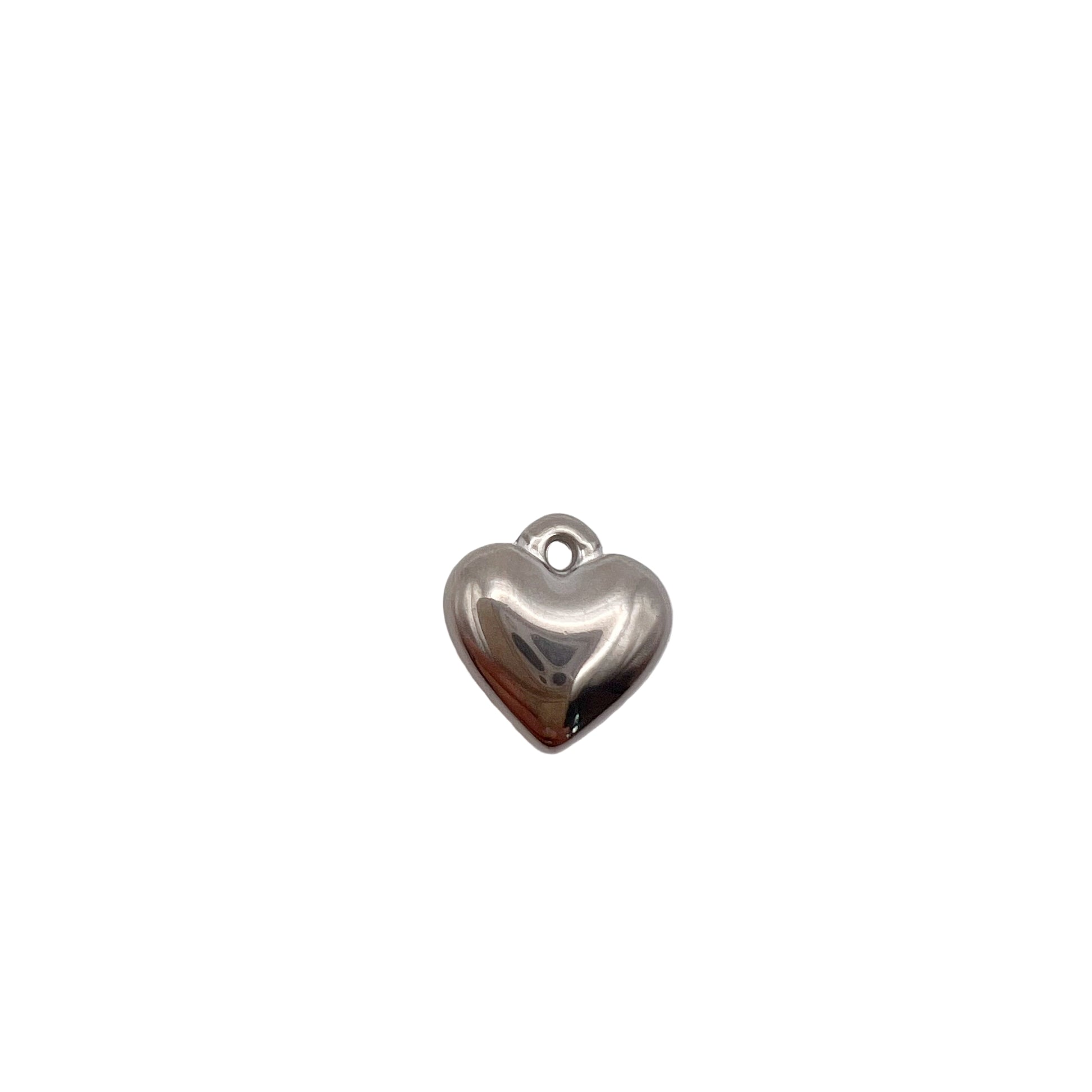 Silver heart-shaped charm on a white background