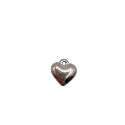 Silver heart-shaped charm on a white background