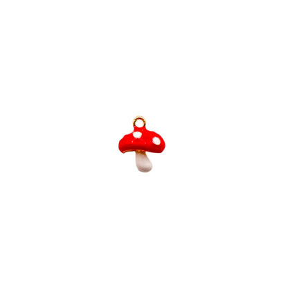 Red mushroom-shaped charm on a white background