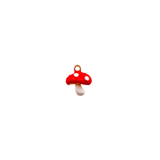 Red mushroom-shaped charm on a white background