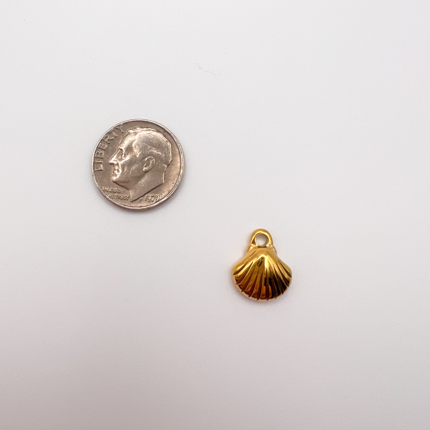 Gold shell charm 