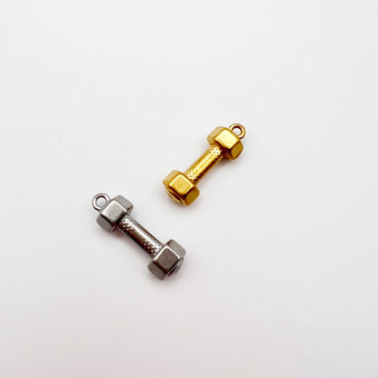 Two dumbbell-shaped charms, one gold and one silver, on a white background.
