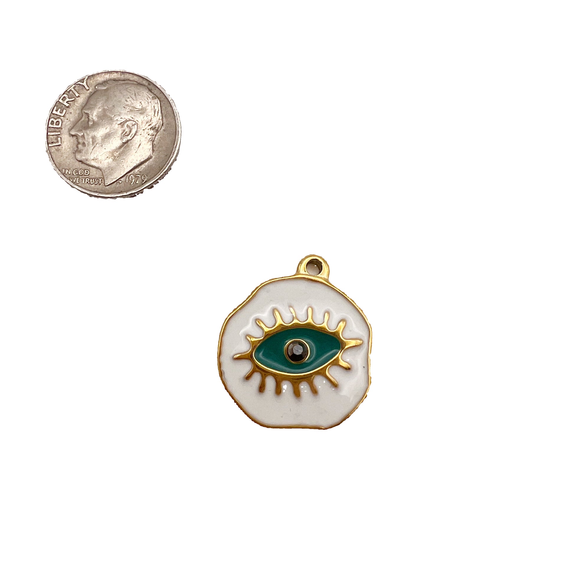 Small evil eye pendant on a white background with a quarter for scale