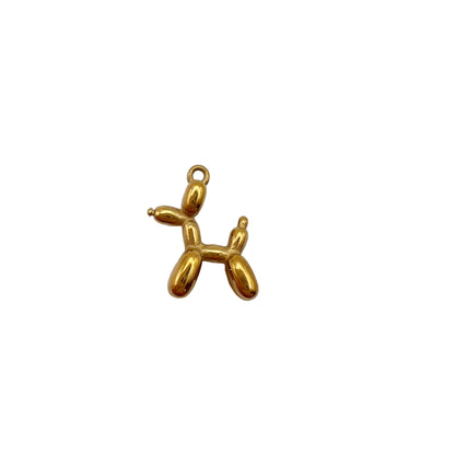 Gold balloon dog charm on a white background