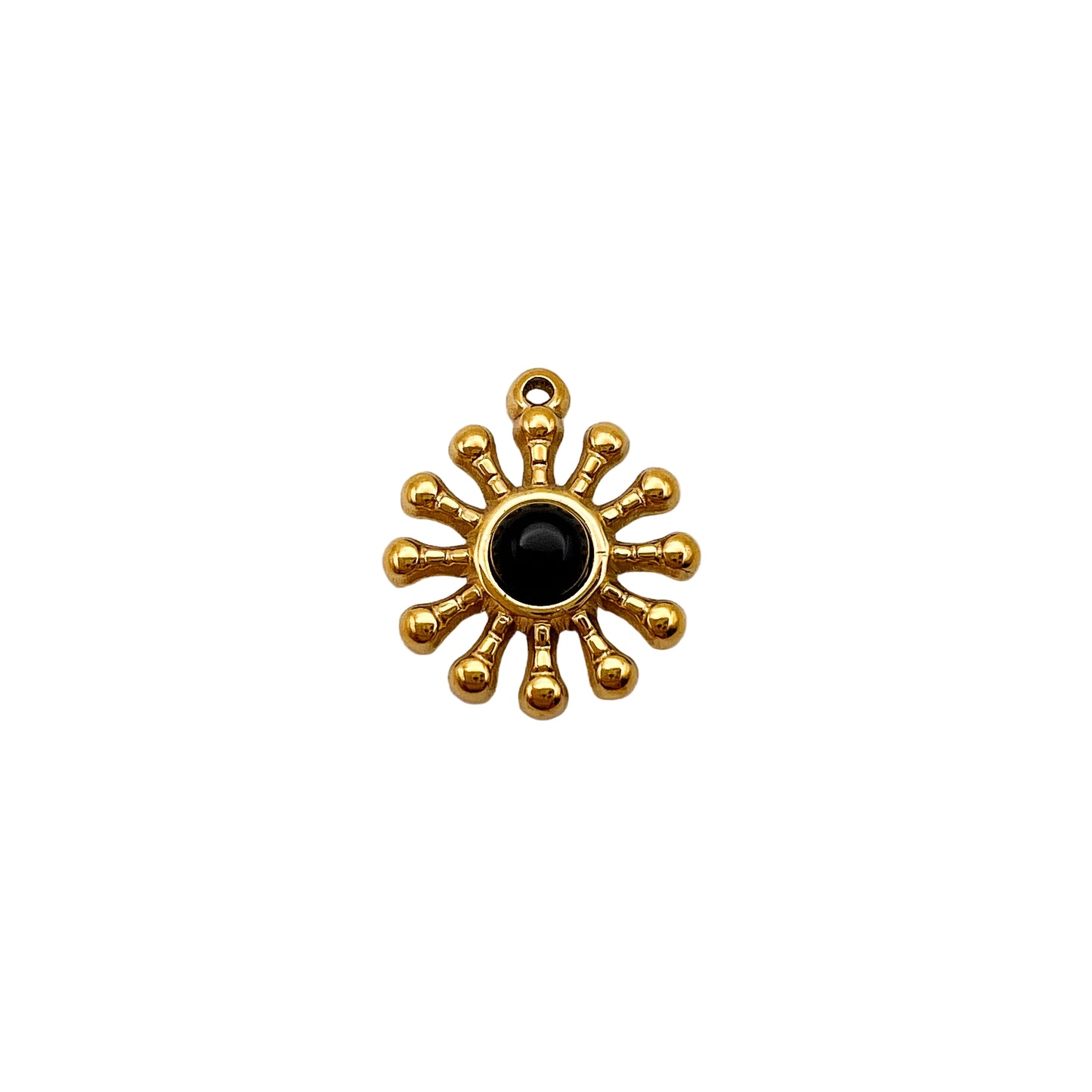 Gold sun-shaped pendant with a black center on a white background