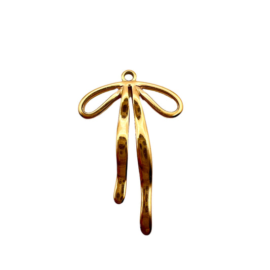 Gold bow pendant on a light gray background