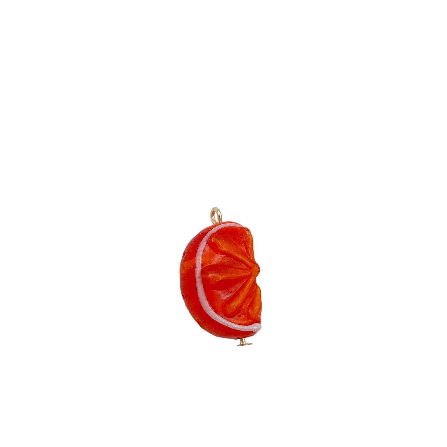 Orange slice charm on a white background