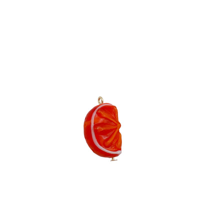 Orange slice charm on a white background