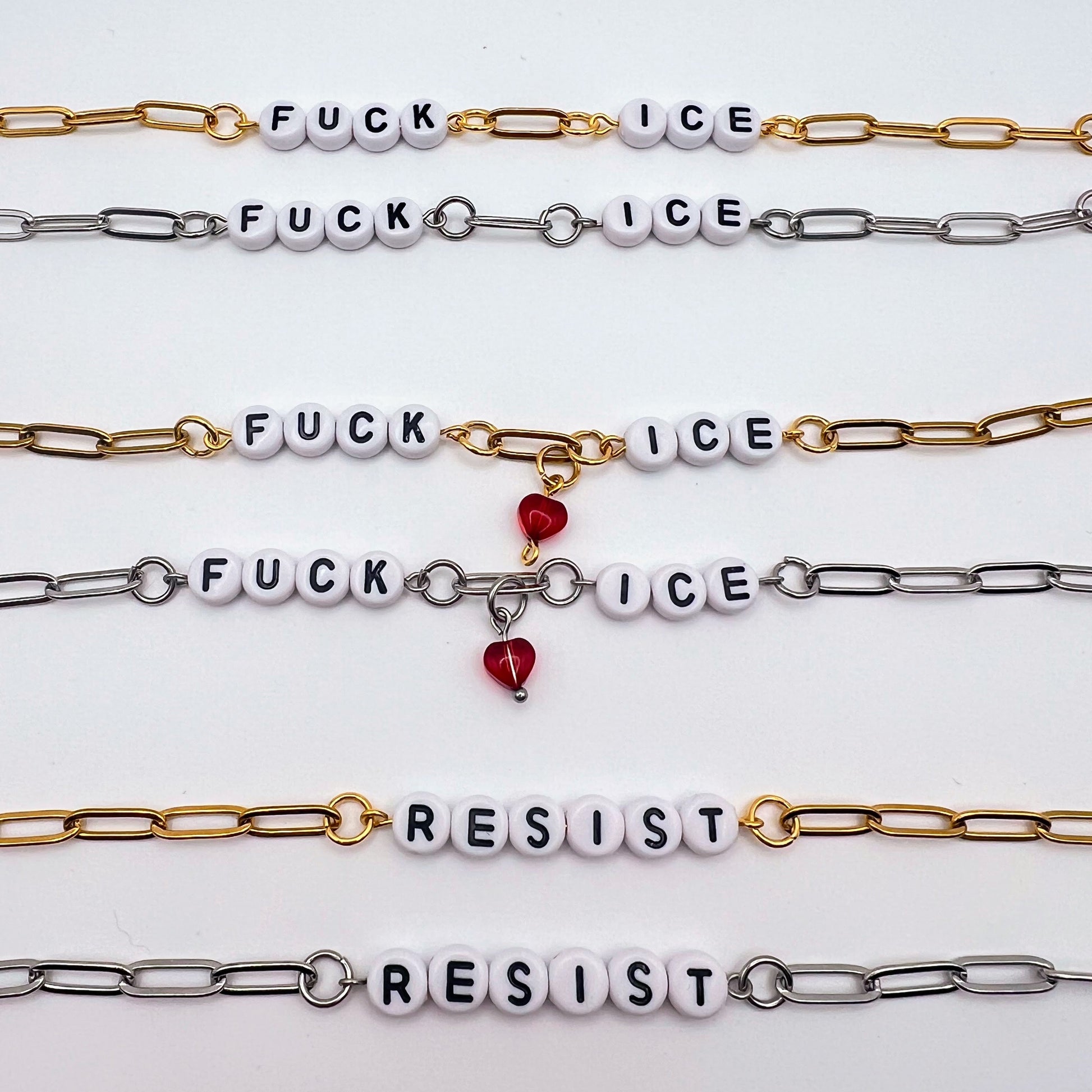 Bracelets with 'F**K ICE' and 'RESIST' text on a white background