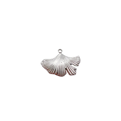 Silver shell pendant on a light gray background