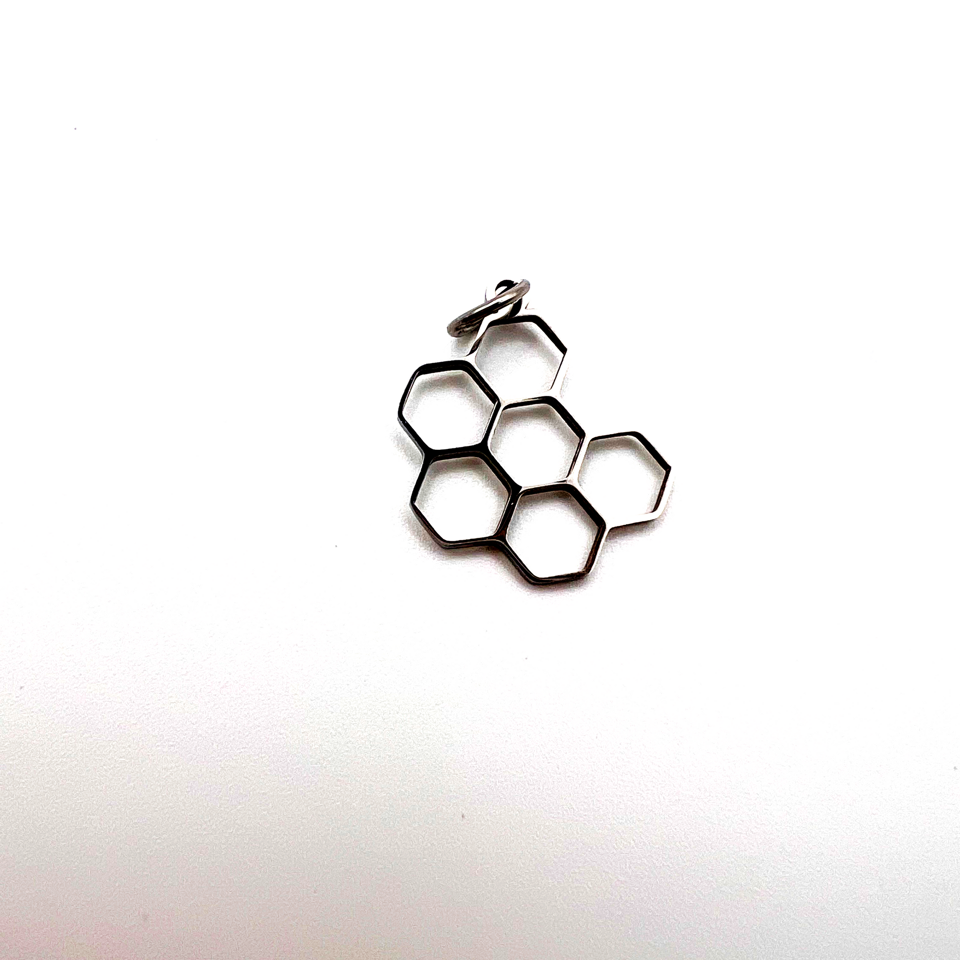 Metallic honeycomb design on a white background