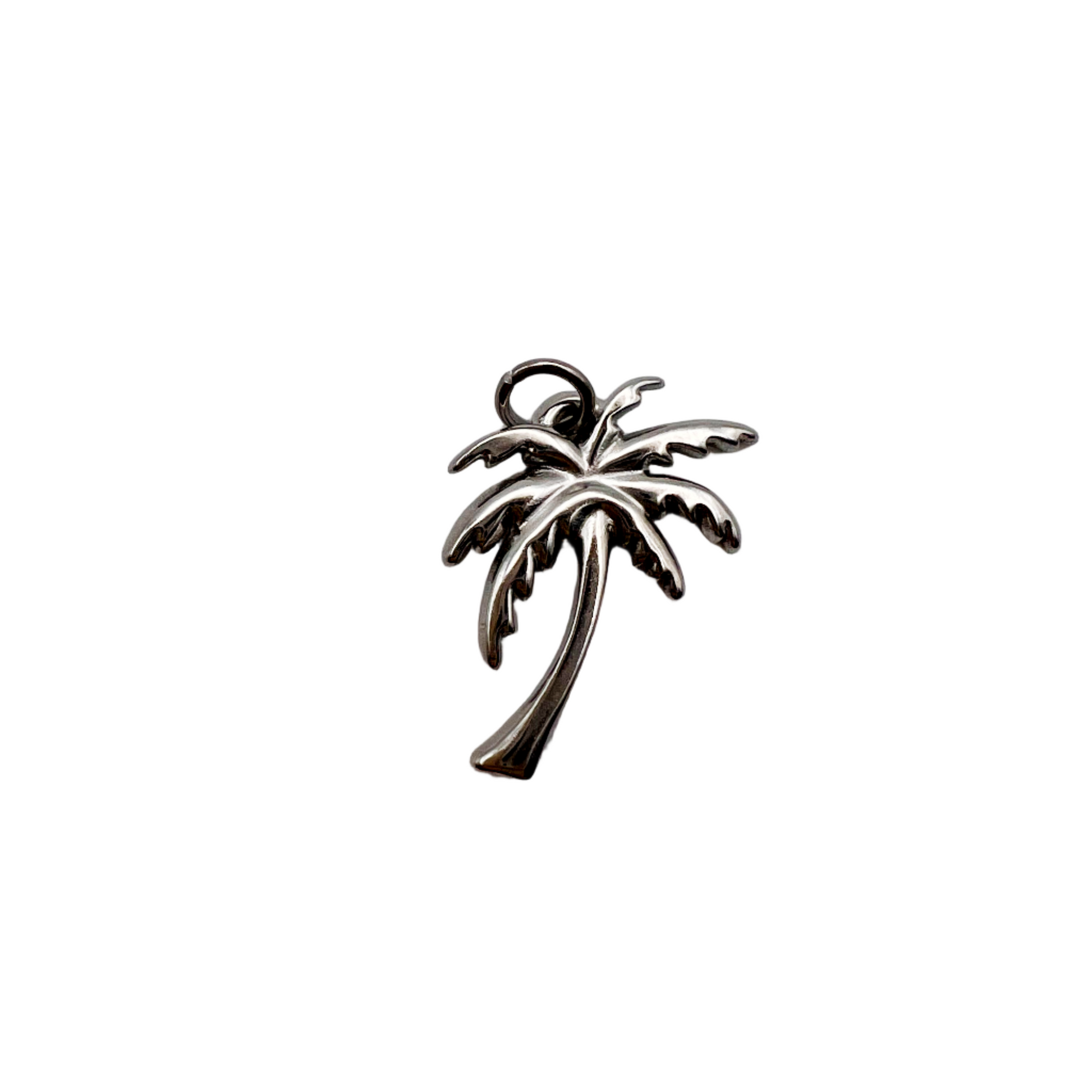 Silver palm tree-shaped object on a white background