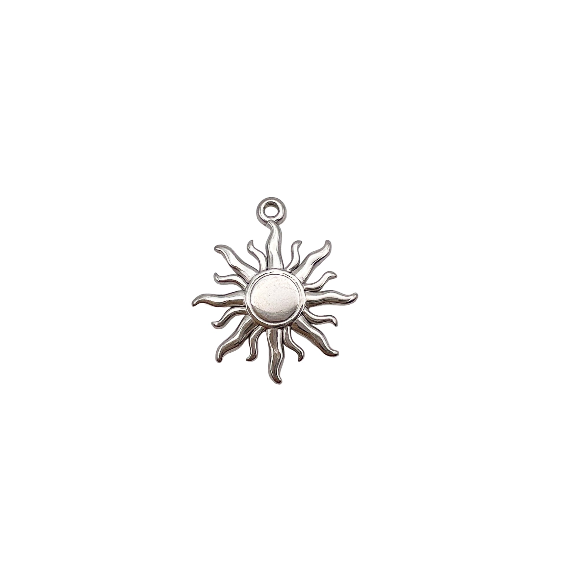 Silver sun-shaped pendant on a light gray background